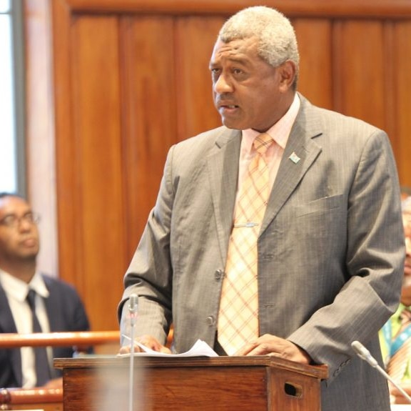 Fiji's Home Affairs Minister Pio Tikoduadua speaks at a lectern in parliament. 