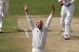 Australia's Nathan Lyon celebrates the wicket of India's Ishant Sharma with his teammates.