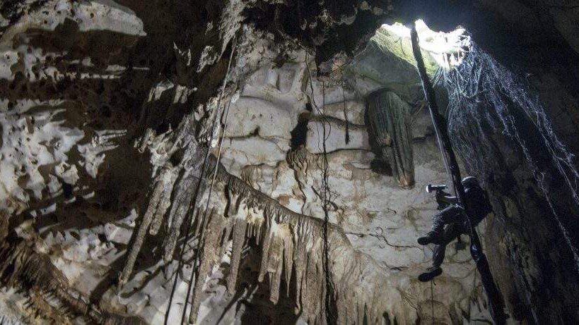 Engineer Corey Jaskolski scans the entrance to Cenote Holtun in Chichen Itza, Mexico.