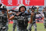 A soldier from Chinese People's Liberation Army shouts during a drill.