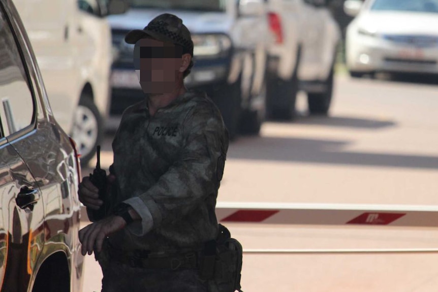 A Tactical Response Group officer outside the Royal Darwin Hospital
