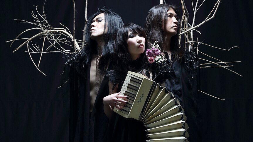 Three members of Japanese band Boris. One member, Wata, holds a piano accordion.