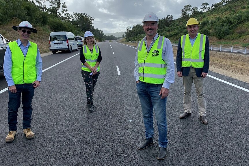 Local politicians Chris Gulaptis and Kevin Hogan on a new section of the Pacific Highway