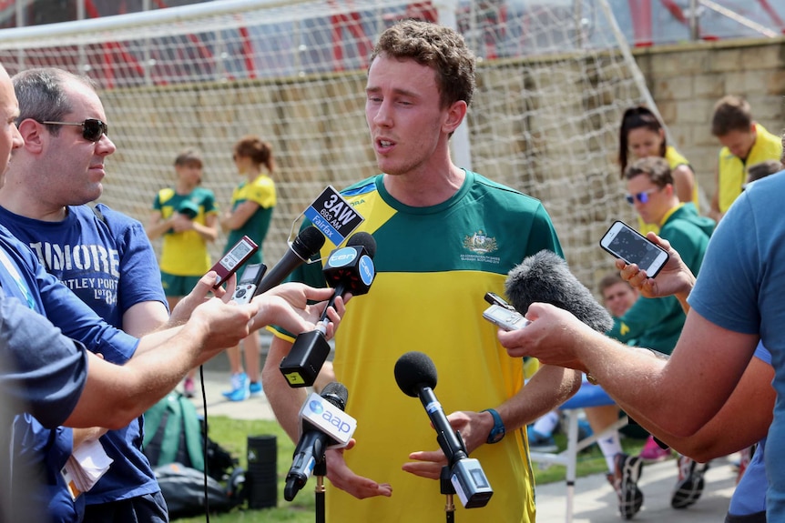 Alex Rowe talks to the media