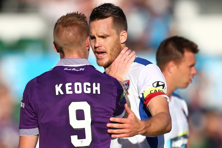 Andy Keogh grabs Nigel Boogaard by the throat