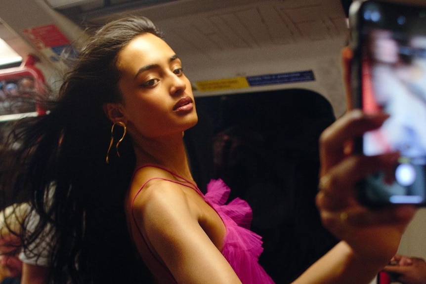 A woman on a train films herself 