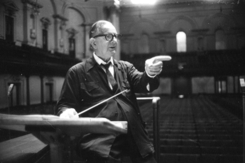 A black and white photograph of Sir Bernard Heinze conducting in the Sydney Town Hall.