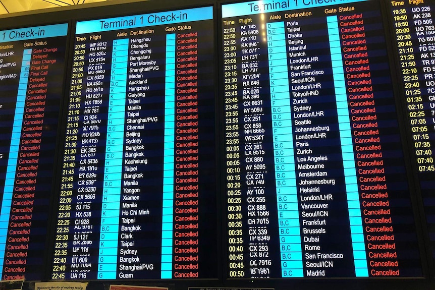 An information board at Hong Kong airport reads all flights cancelled