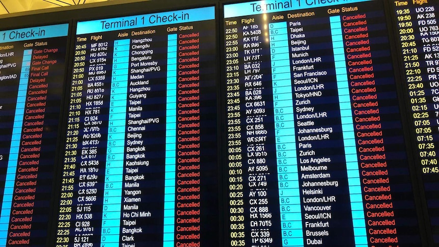 An information board at Hong Kong airport reads all flights cancelled