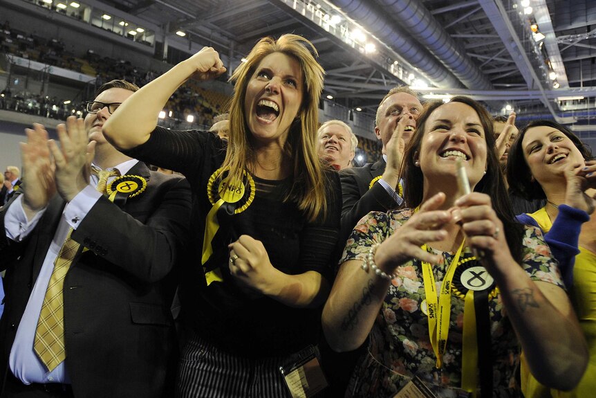 SNP supporters celebrate as election results are announced in Glasgow.