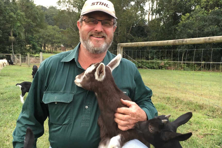 Leo Phelan posing with the kids in the field.