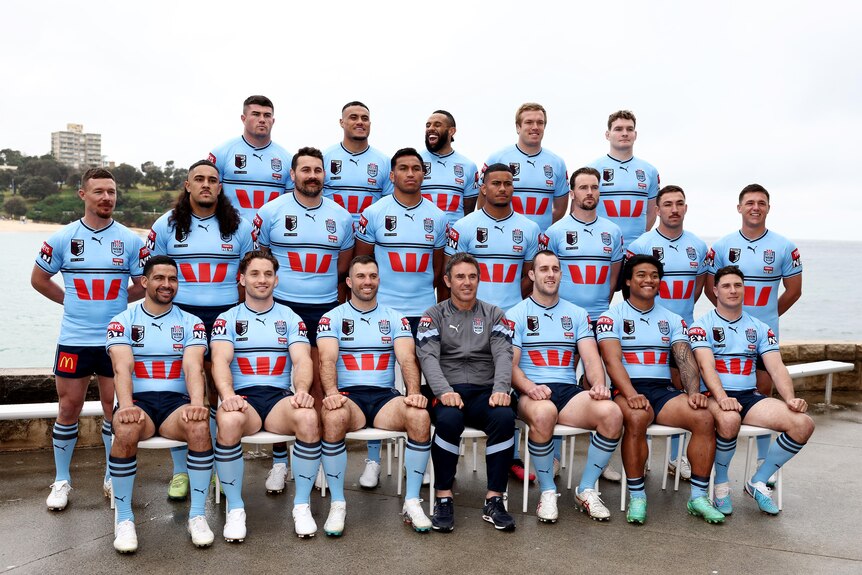 A rugby league team assembles for a team photo