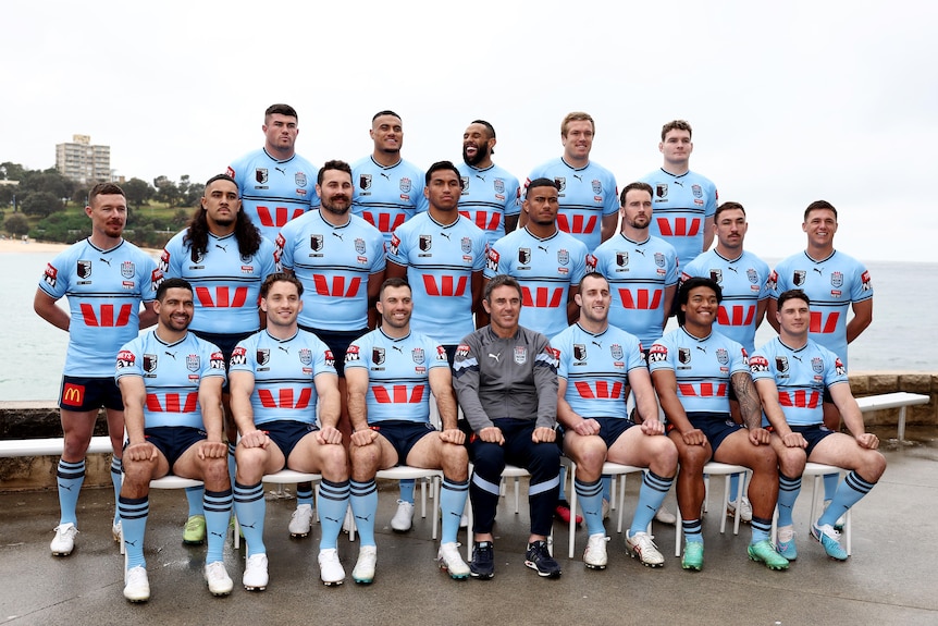 A rugby league team assembles for a team photo
