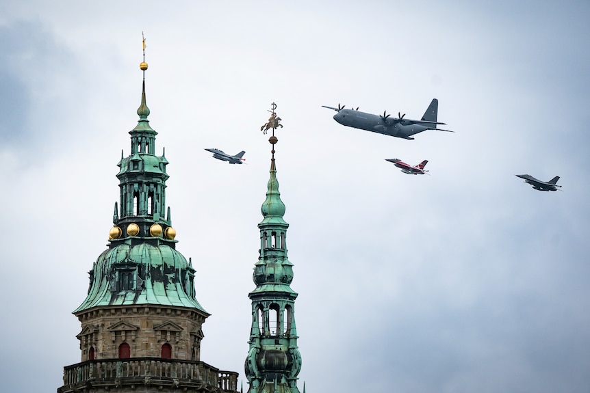 Jets fly past Kronborg Castle in Denmark. 