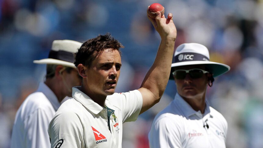 Australia's Steven O'Keefe celebrates a wicket on day two of the first Test against India in Pune.