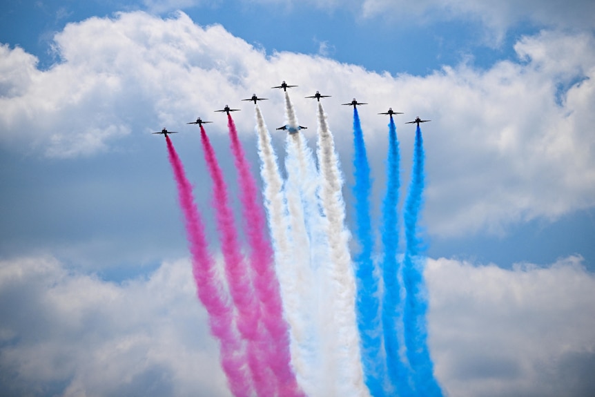 Planes release smoke in the colours of red white and blue 