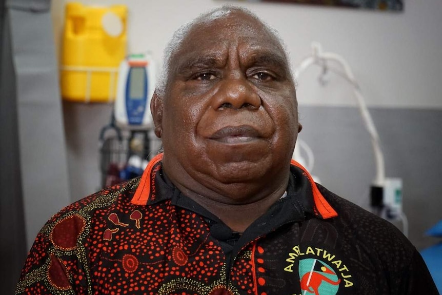 Nigel Morton, standing in front of medical equipment, looks at the camera.