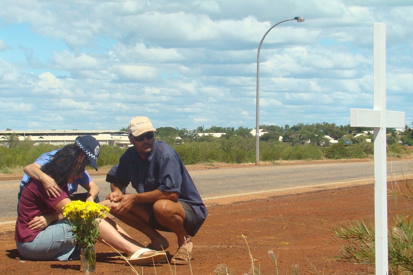 Ingrid Bishop is consoled after erecting a cross at site of son, Josh Warneke's death, Broome