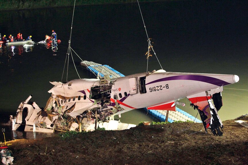 Wreckage of Taiwan plane crash lifted out of water