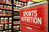 Over-the-counter bodybuilding supplements sit on a shelf