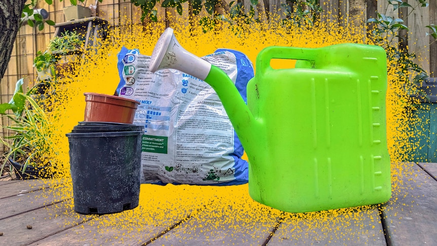A pile of plastic pots, a bright green plastic watering can and a bag full of soil in soft plastic in a backyard.