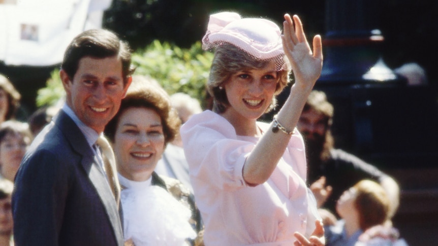A photo of Princess Diana and Prince Charles, Diana is waving to the crowd