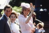 A photo of Princess Diana and Prince Charles, Diana is waving to the crowd