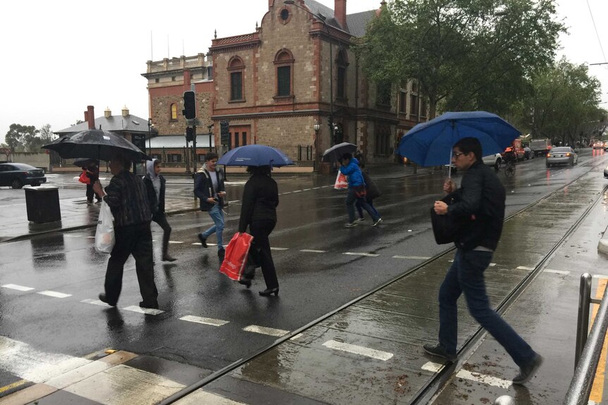 Commuters caught in the rain in Adelaide