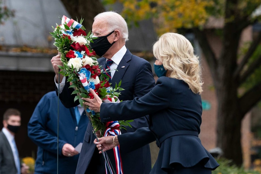 President-elect Joe Biden, and Jill Biden, place a wreath at the Philadelphia Korean War Memorial at Penn's Landing