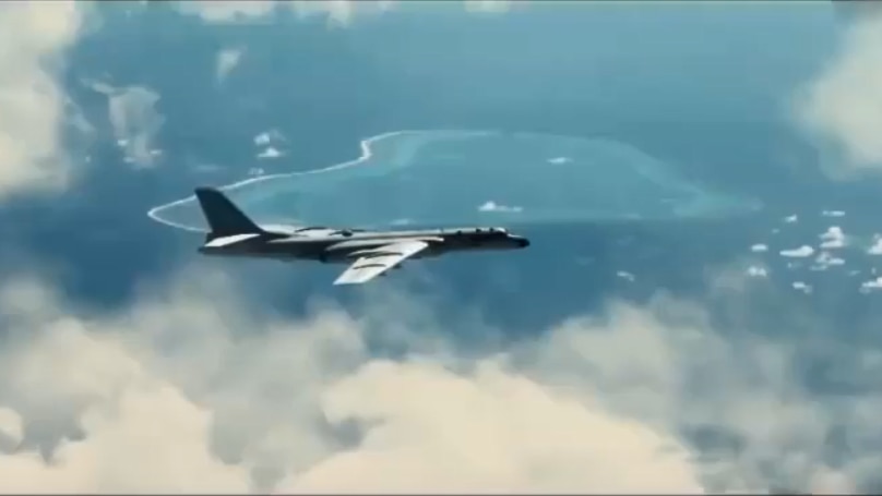 A fighter jet flies through the clouds with an island in the background.