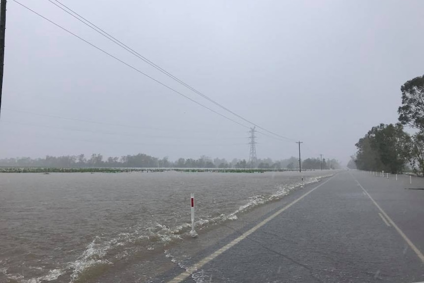 Water lapping up on the side of Bruce Highway.