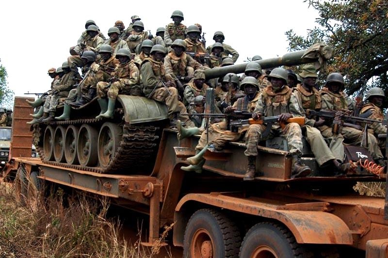 Ugandan soldiers on tank transporter