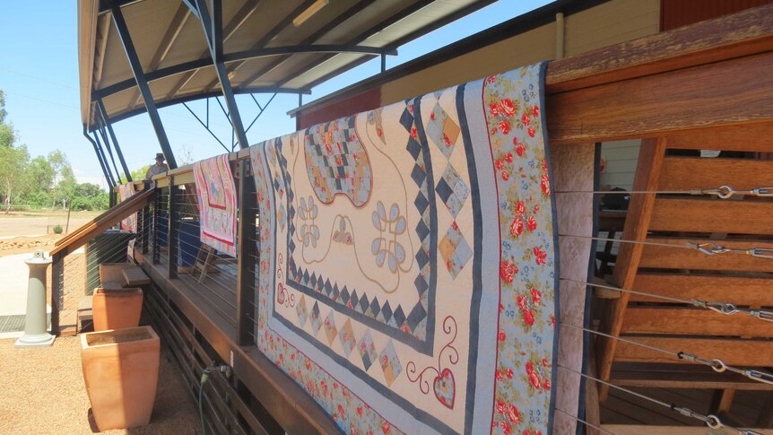 Quilts on verandah railing at an outback hall at Stonehenge, south-west of Longreach,