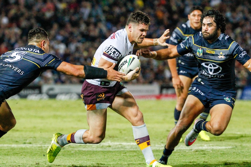 James Roberts looks for a gap in the Cowboys' defence.