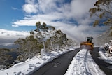 Snow clearing on a mountain road.
