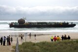 Authorities say the barge stranded on Tugun Beach has not been damaged.