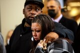 Daunte Wright's parents cry as they leave the court room.