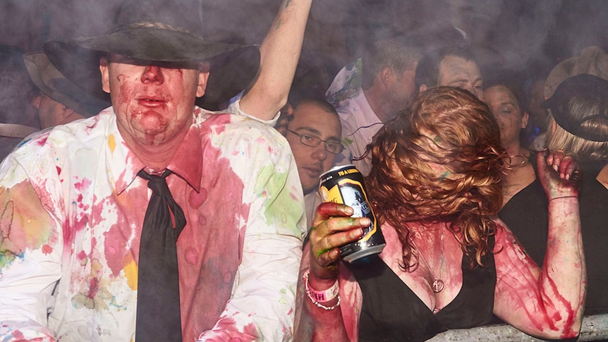 Two drunk people covered in food dye at a B&S ball ball