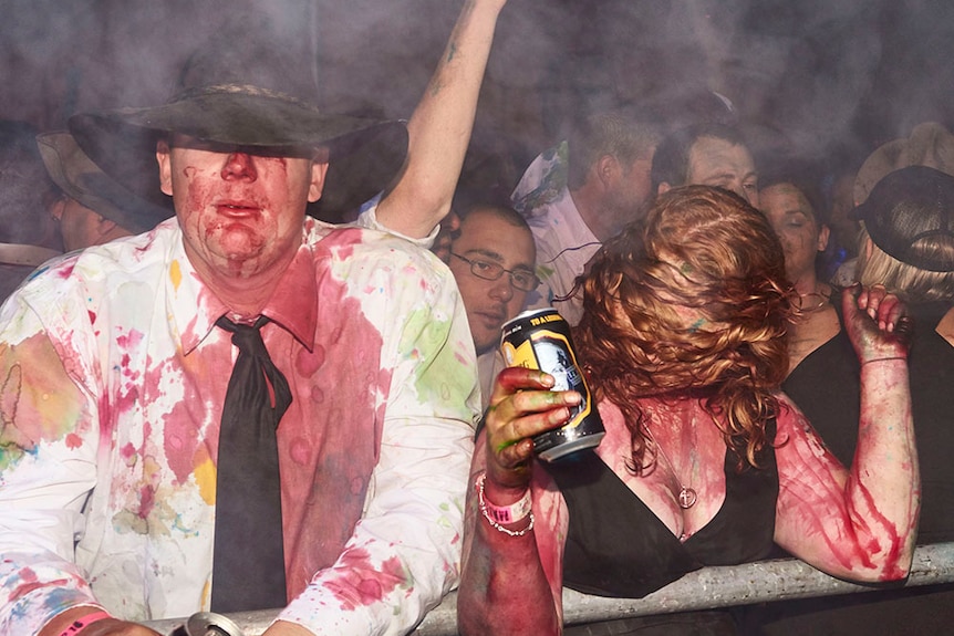 Two drunk people covered in food dye at a B&S ball ball