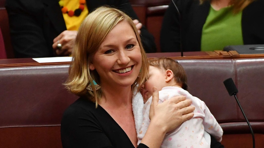 Greens Senator Larissa Waters soothes baby Alia Joy after breastfeeding her in the Senate, May 9, 2017.