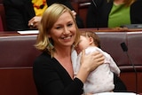 Greens Senator Larissa Waters soothes baby Alia Joy after breastfeeding her in the Senate, May 9, 2017.