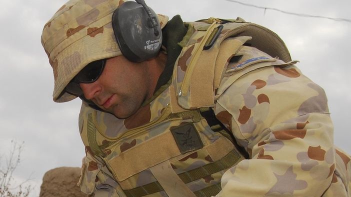 Cash for training: Sapper Tim Lee from the Darwin-based 1 Combat Engineer Regiment in Afghanistan