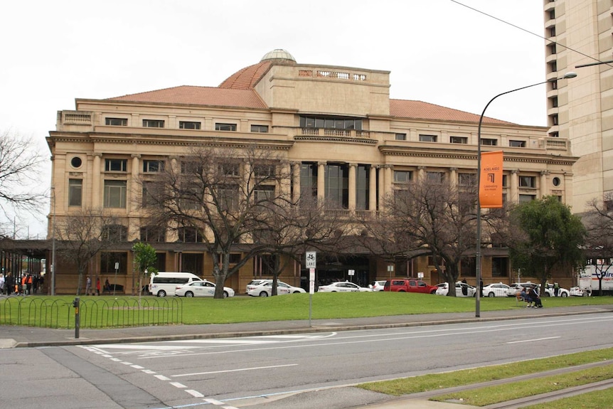 A large stone building on a park