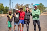Youth workers Chloe Fricker and Giovanni Mamea with come of the young people they work with in Laverton.