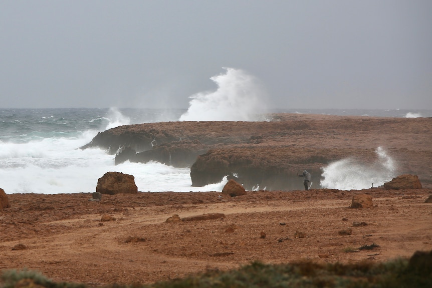 A big swell and waves crash into rocks at the Blowholes near Carnarvon.