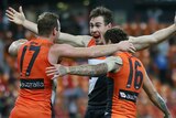 The Giants hug Jeremy Cameron after his winning goal against Richmond