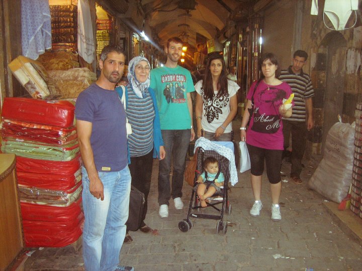 Amina and family at a market in Aleppo