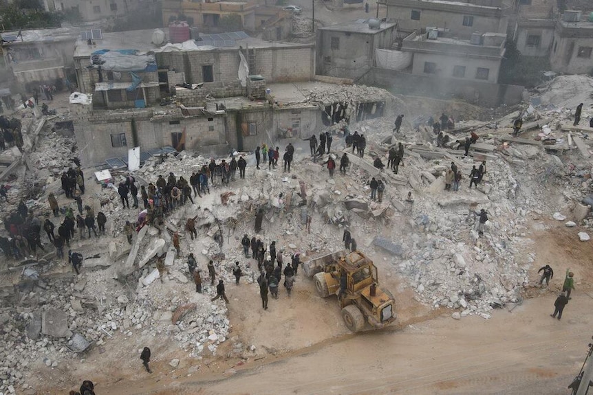 An aerial view of collapsed buildings in north-west Syria.