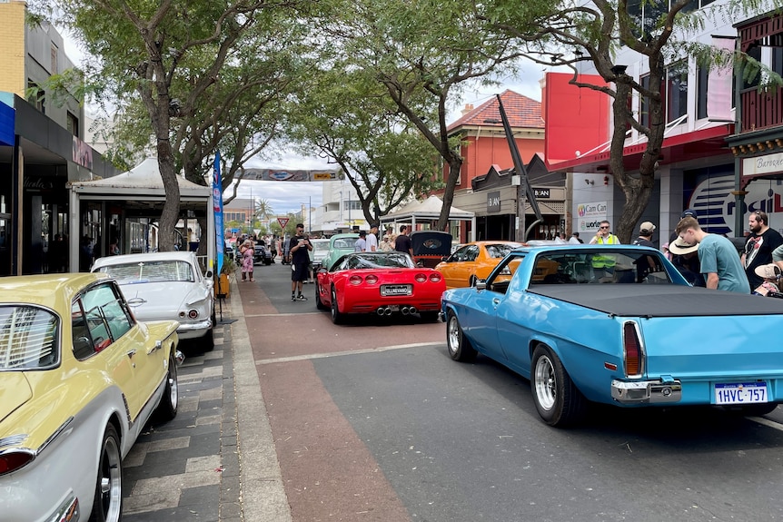 Old and rare vehicles on a street in an country city.