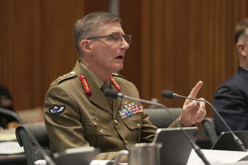 Defence Chief Angus Campbell speaking in military uniform. 